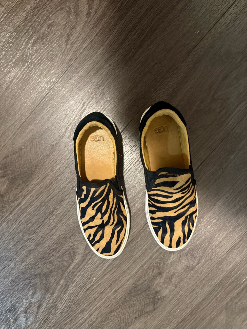 UGG women Slip-On Sneakers in Black & Tan Tiger Print
